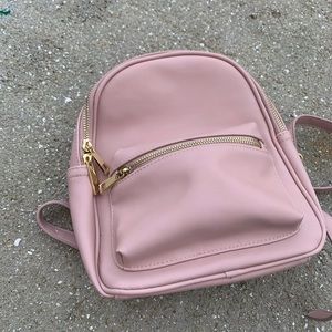 Light pink faux-leather small backpack
